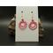 Pink machine embroidered circle with smaller circle inside earrings made of smaller loops. Gold hypoallergenic hooks.